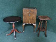 A walnut Queen Ann style bedside cabinet together with a carved two tier plant stand and a shaped