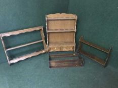 An oak wall shelf fitted two drawers and three other wall shelves