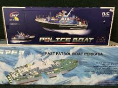 A remote controlled Vosper patrol boat together with a remote controlled police boat