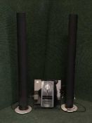 A Bang & Olufsen MCMXCI cd system together with a pair of tower speakers with leads