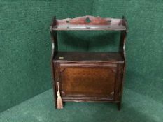 A mahogany wall cupboard bearing Harrods of Manchester label