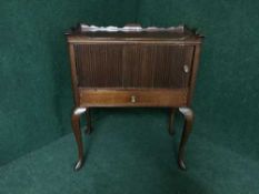 A mahogany cabinet on cabriole legs