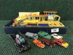 A box of Hornby Dublo station and platform, boxed Hornby and Matchbox die-cast vehicles,