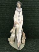 A Lladro figure - female in clown costume with mandolin numbered 6447