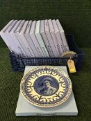 A basket of fourteen boxed Wedgwood collector's plates and a jasper ware dish