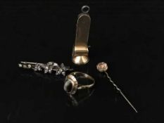 A gold, green garnet and diamond bar brooch, an 18ct gold 'cat's eye' agate ring,