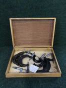 A wooden cutlery canteen of eight assorted precision measuring tools