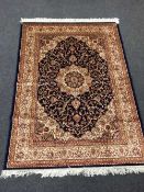 A fringed Persian Kashan rug with silk pile 190 cm x 140 cm