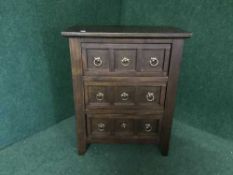 A contemporary three drawer chest with drop handles