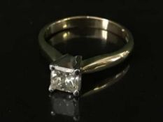 An 18ct gold princess cut diamond solitaire ring, the diamond weighing an estimated 0.