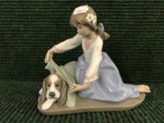 A Lladro figure - Girl with dog,