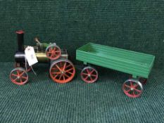 A Mamod live steam engine with trailer