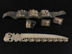 A suite of Indian silver jewellery; bracelet, earrings and ring,