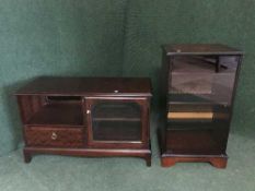 A mahogany stag minstral audio cabinet together with a mahogany cabinet