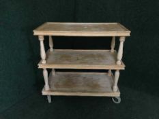 A pine three tier serving trolley