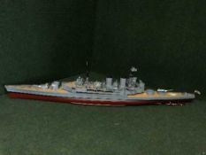 A large remote controlled scale model of a British battle ship