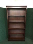 A large set of mahogany open shelves