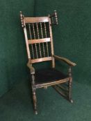 A late nineteenth century bobbin wing rocking chair