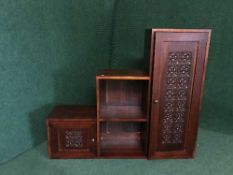 A mahogany graduated step cabinet