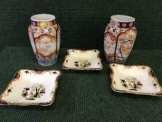 A pair of late 19th century Imari vases and three Cetem ware Imari pattern dishes