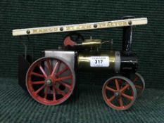A Mamod live steam tractor engine