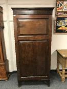 A Victorian mahogany single door wardrobe