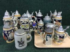 A collection of pewter topped beer steins