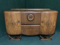 A walnut cocktail sideboard