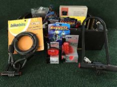 A box of bicycle accessories including halogen head lights, relfectors,