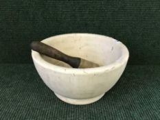 A large marble mortar with pestle
