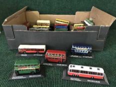 A box of Great British Buses and Trams on stands