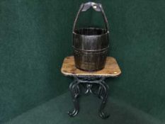 A pine topped metal based lamp table together with a wooden water bucket