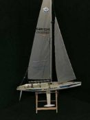 A large two masted pond yacht on stand