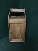 An Ikea pine storage cabinet