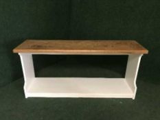 A reclaimed pine hall bench