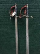 A pair basket handled swords,