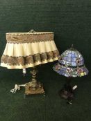 A decorative gilt metal table lamp on marble base and Tiffany style lamp