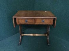 A small inlaid yewwood sofa table fitted with two drawers