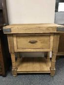 A reclaimed pine butcher's block fitted with a drawer