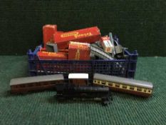 A box of Triang carriages, train locomotive, platform ramps,