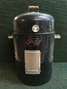 A Brinkman Gourmet charcoal smoker