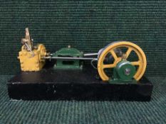 A hand-built steam engine on wooden stand