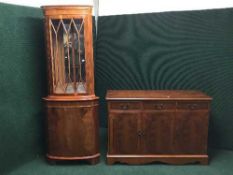 An inlaid yew wood triple door sideboard and matching corner cabinet