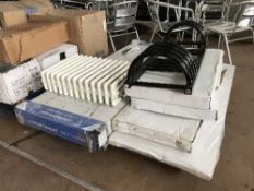 A pallet of assorted radiators and towel rails