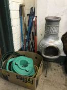 A chiminea, hose pipe on reel,