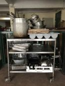 A stainless steel trolley, cooking pots, frying pans, stainless steel pieces,