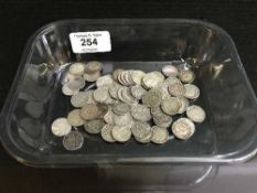 A collection of over 70 three pence pieces,