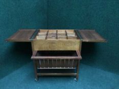A mid 20th century teak sewing trolley