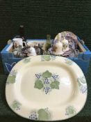 A box of collector's plates, china and glass bells, oak canteen,