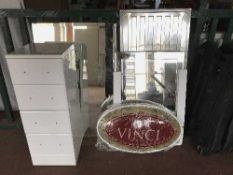 A white high gloss bathroom chest, three bathroom mirrors,